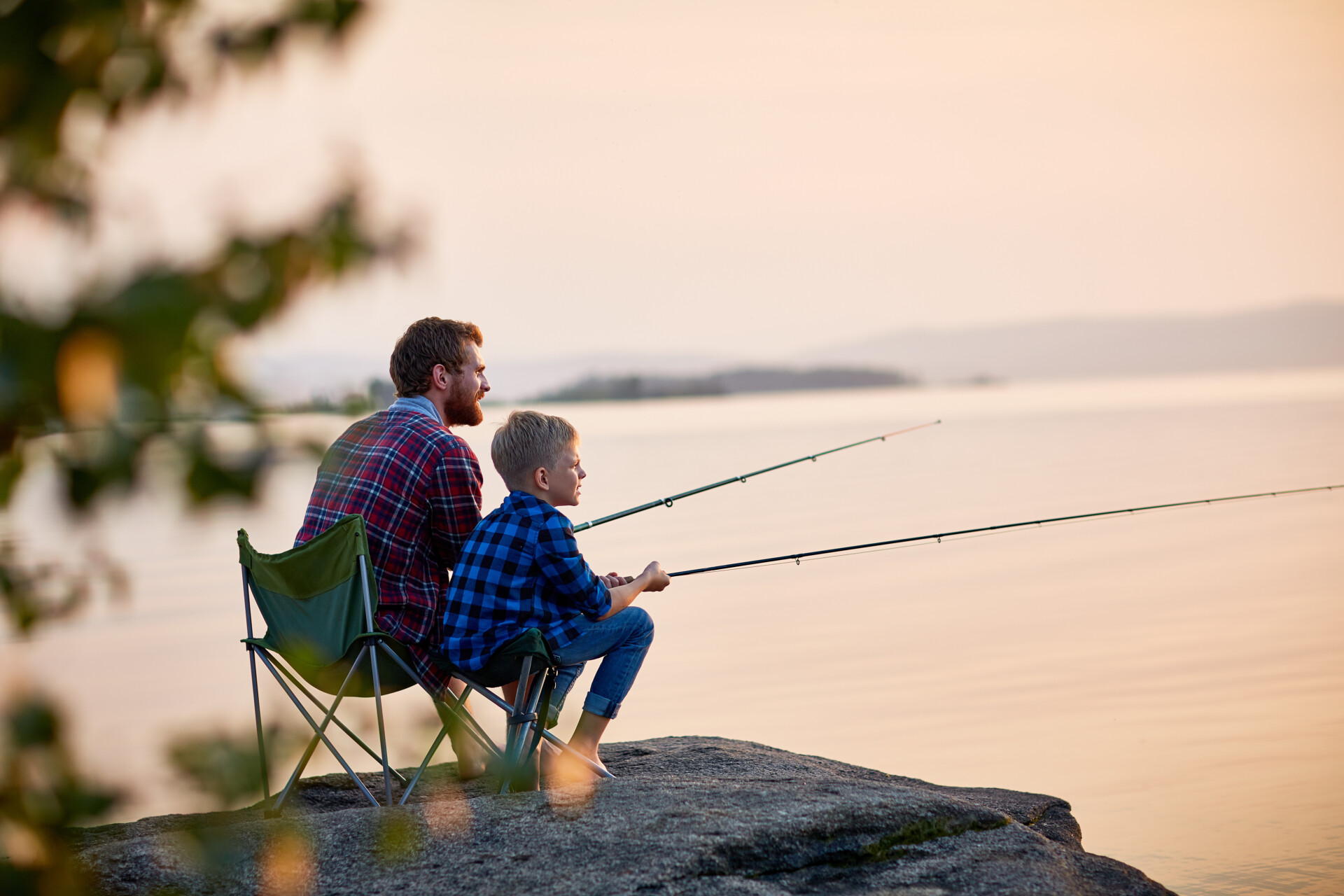 Father And Son Enjoying Fishing Together