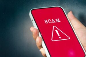 phone with scam alert symbol